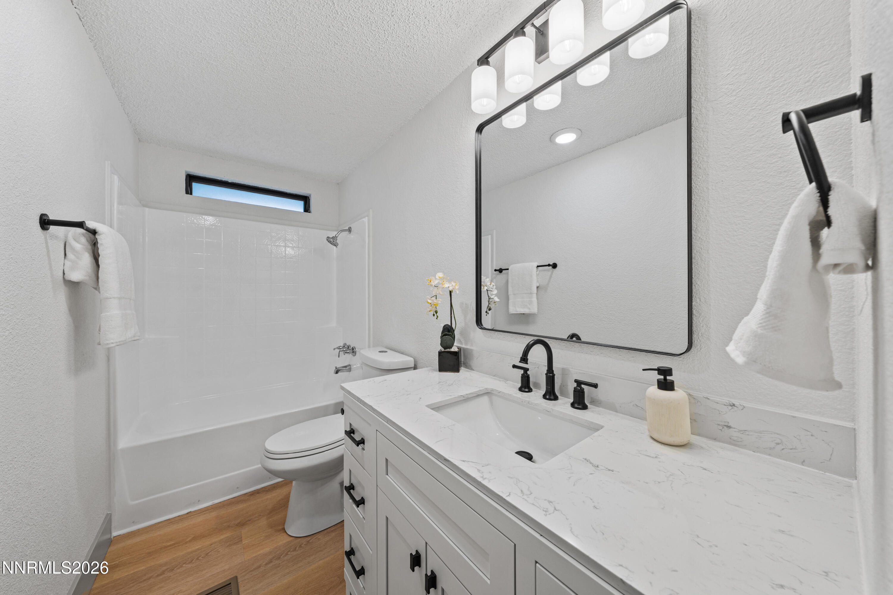 239 Rue De La Chartreuse Sparks, NV 89434 - Photo 10 of 24 a bathroom with a sink a toilet and shower
