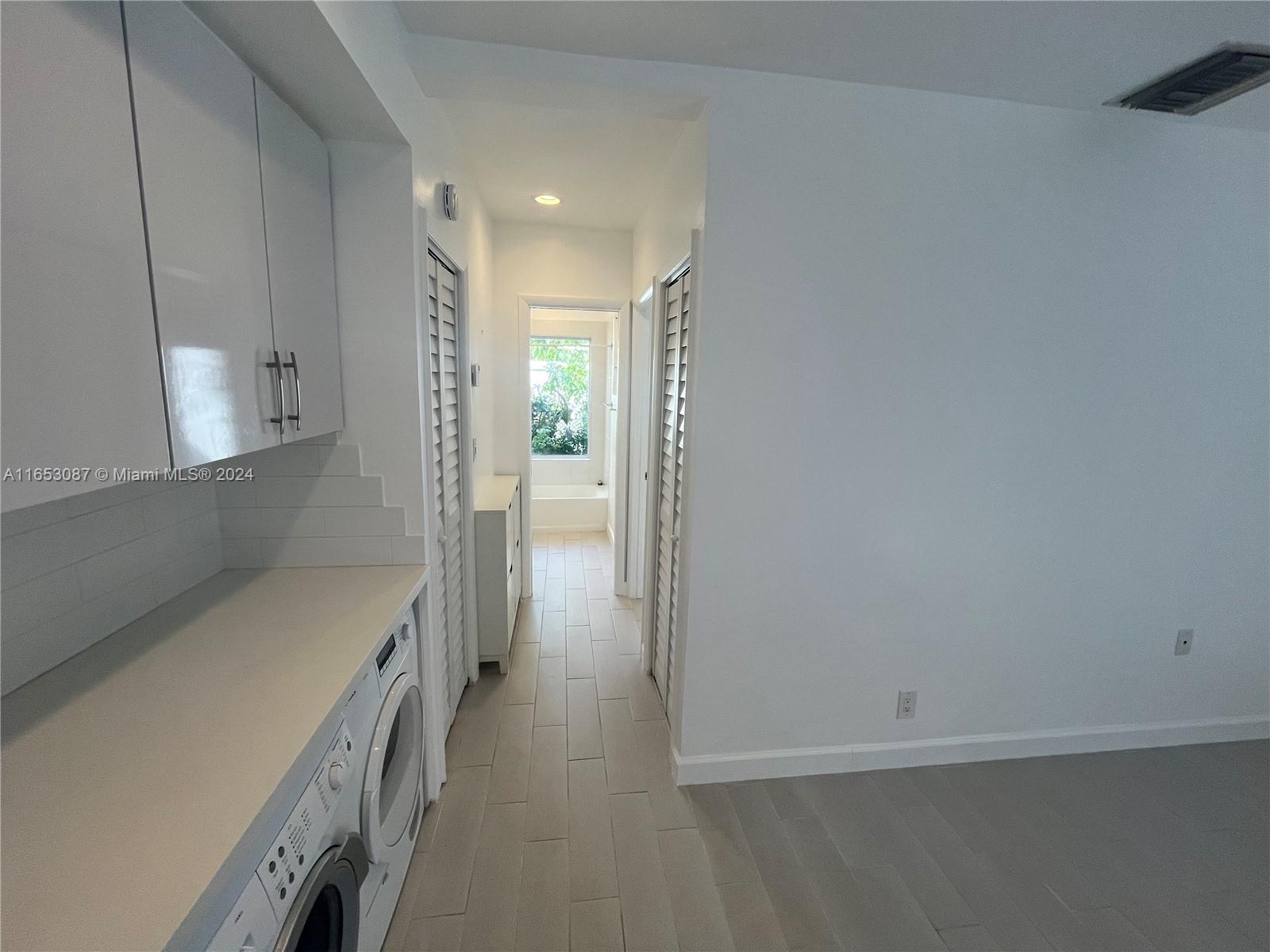 3475 Southwest 1st Avenue, Unit 7 Miami, FL 33145 - Photo 13 of 17 a view of hallway with wooden floor