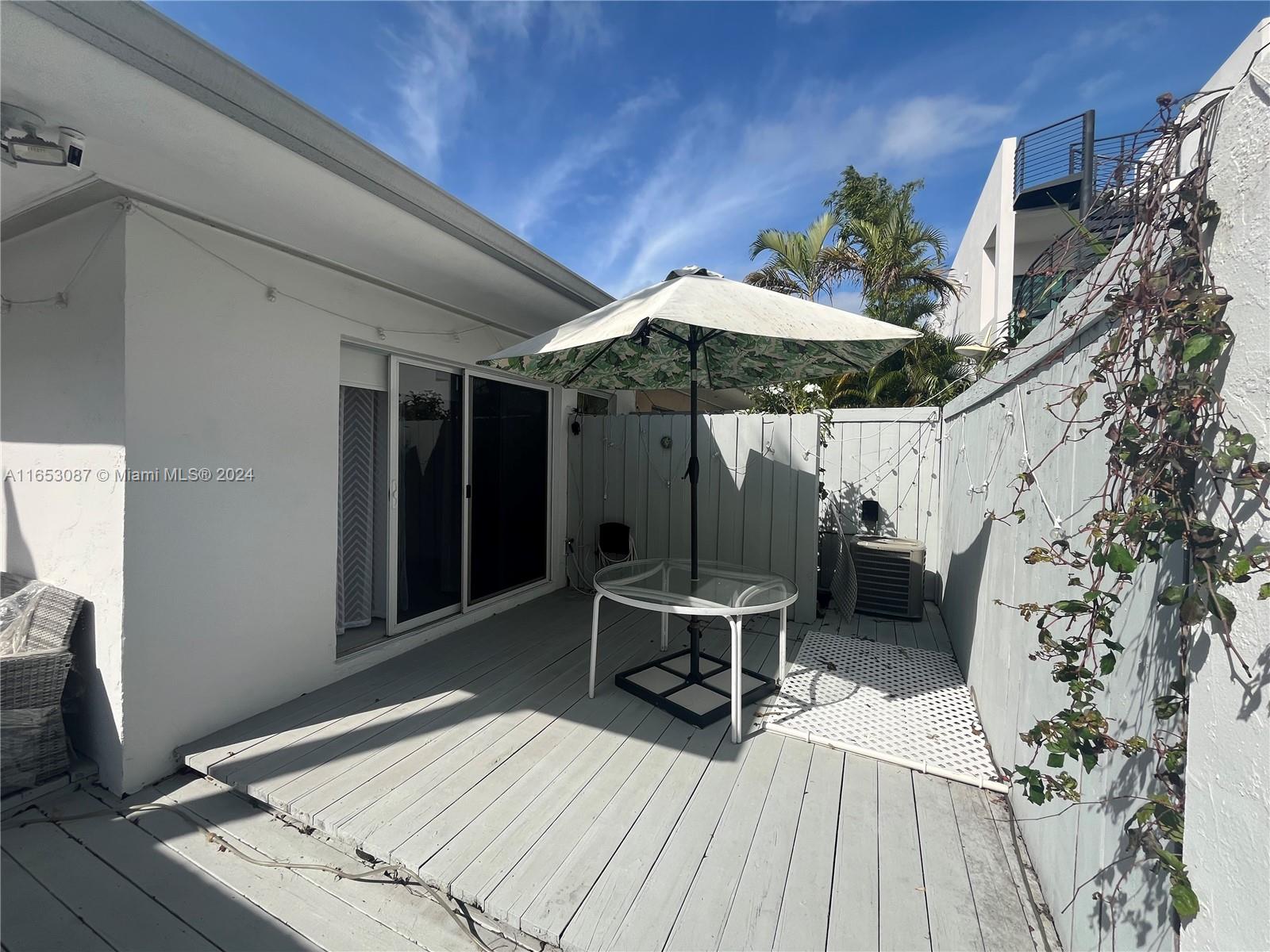 3475 Southwest 1st Avenue, Unit 7 Miami, FL 33145 - Photo 15 of 17 a view of outdoor space deck and patio