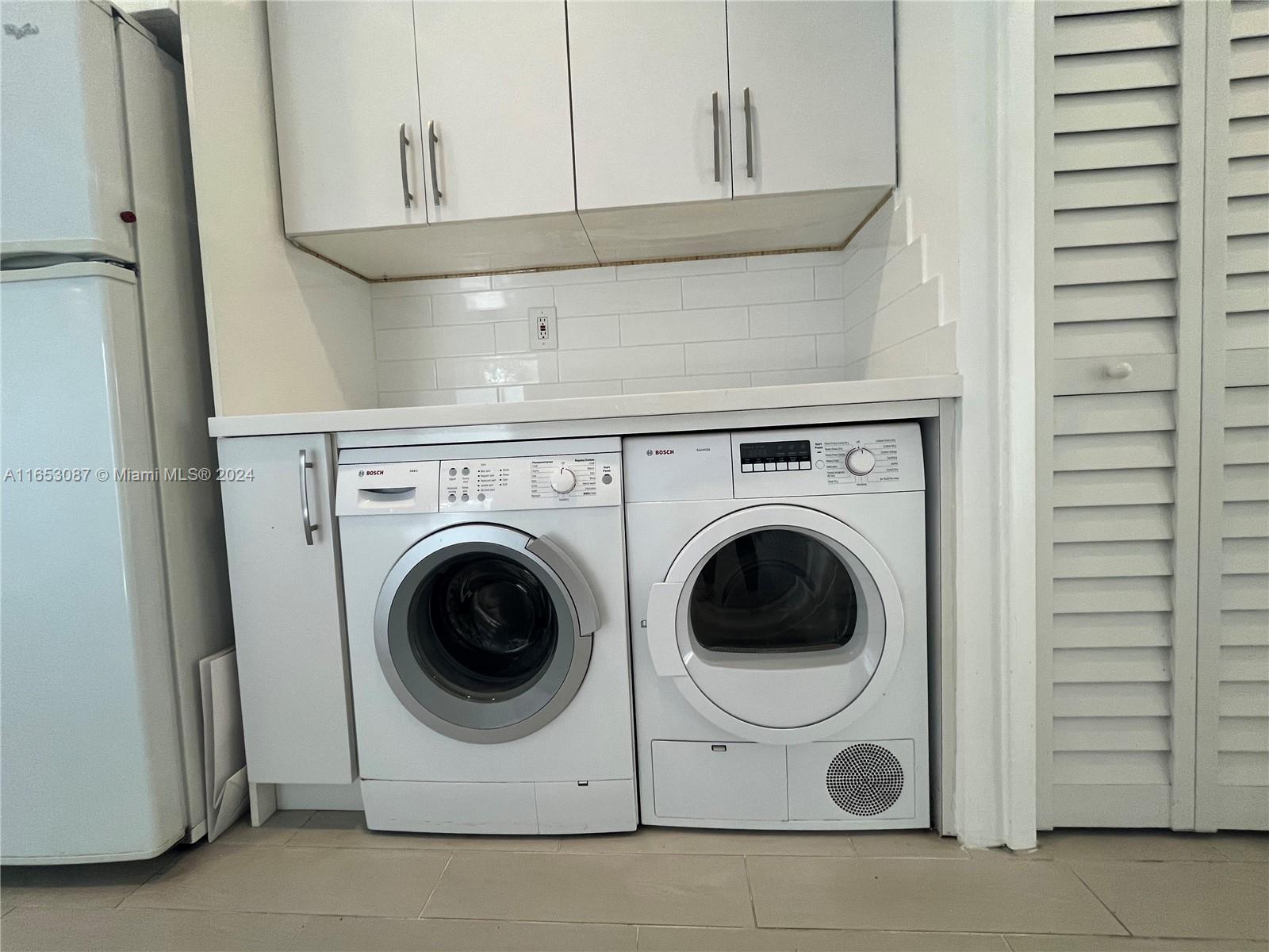 3475 Southwest 1st Avenue, Unit 7 Miami, FL 33145 - Photo 5 of 17 a utility room with dryer and washer