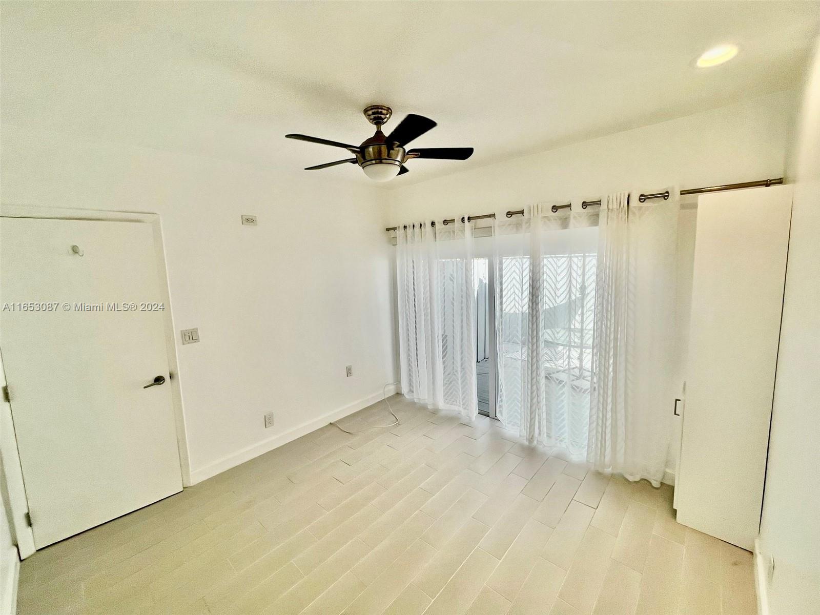 3475 Southwest 1st Avenue, Unit 7 Miami, FL 33145 - Photo 8 of 17 wooden floor in an empty room