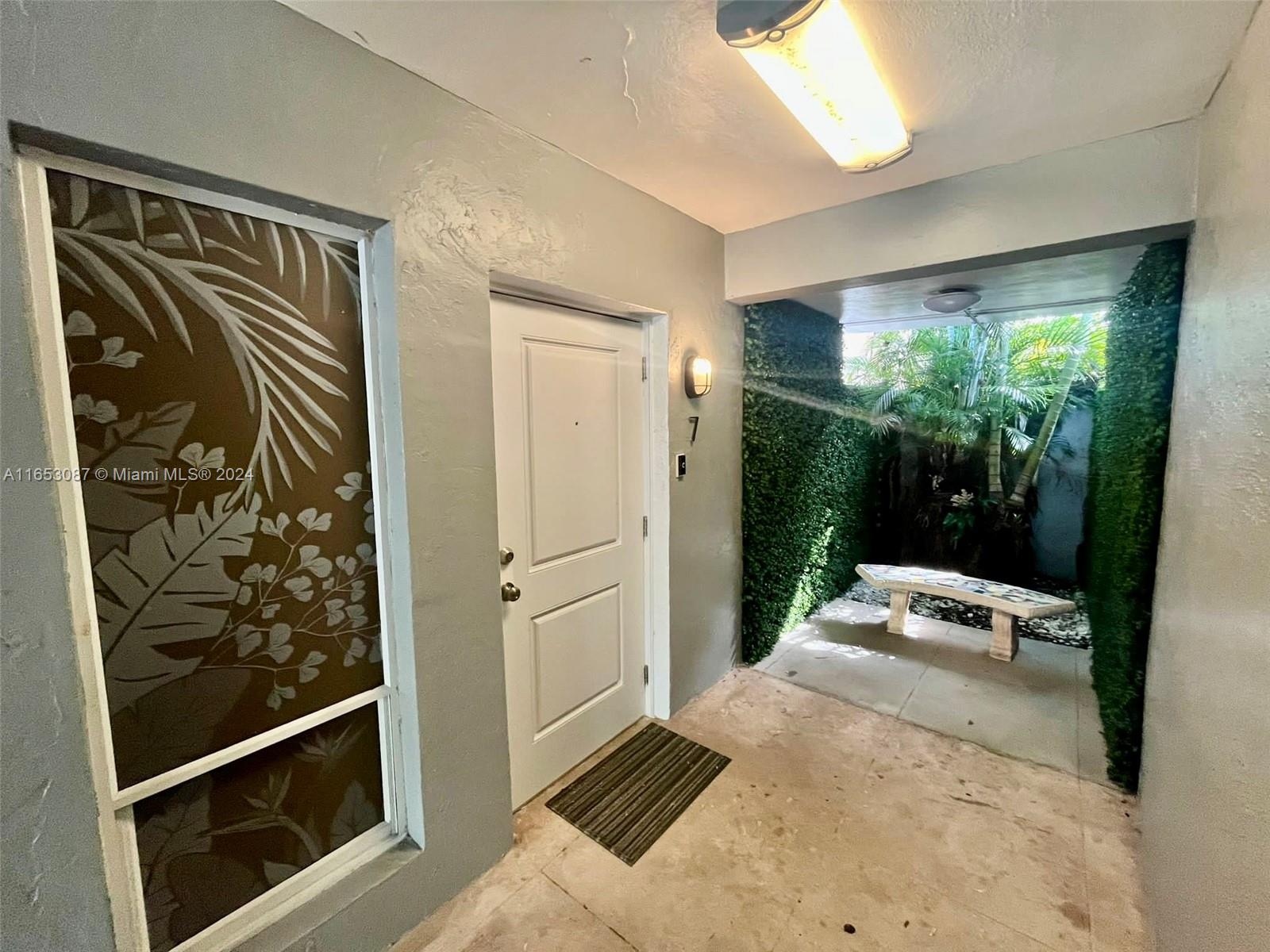 3475 Southwest 1st Avenue, Unit 7 Miami, FL 33145 - Photo 9 of 17 a bedroom with a bed and a window