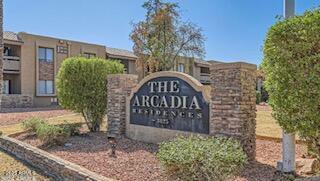 3825 East Camelback Road, Unit 114 Phoenix, AZ 85018 - Photo 1 of 21 a view of a brick wall and a flower garden