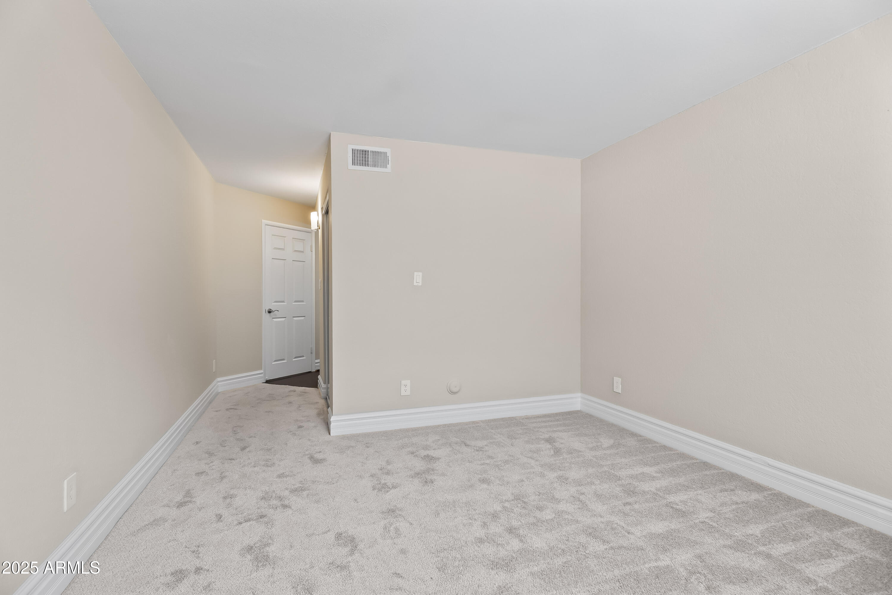 3825 East Camelback Road, Unit 114 Phoenix, AZ 85018 - Photo 11 of 21 an empty room with an entryway