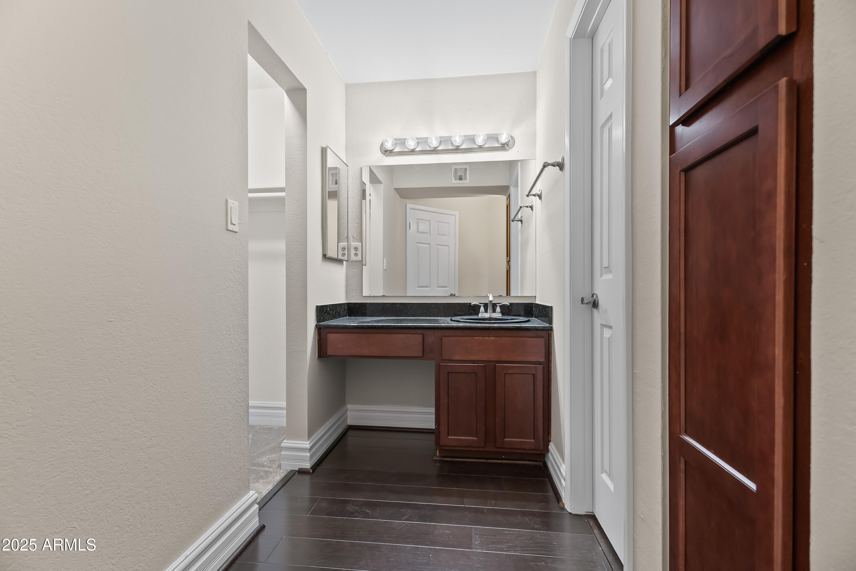 3825 East Camelback Road, Unit 114 Phoenix, AZ 85018 - Photo 7 of 21 a room with a bench and a mirror