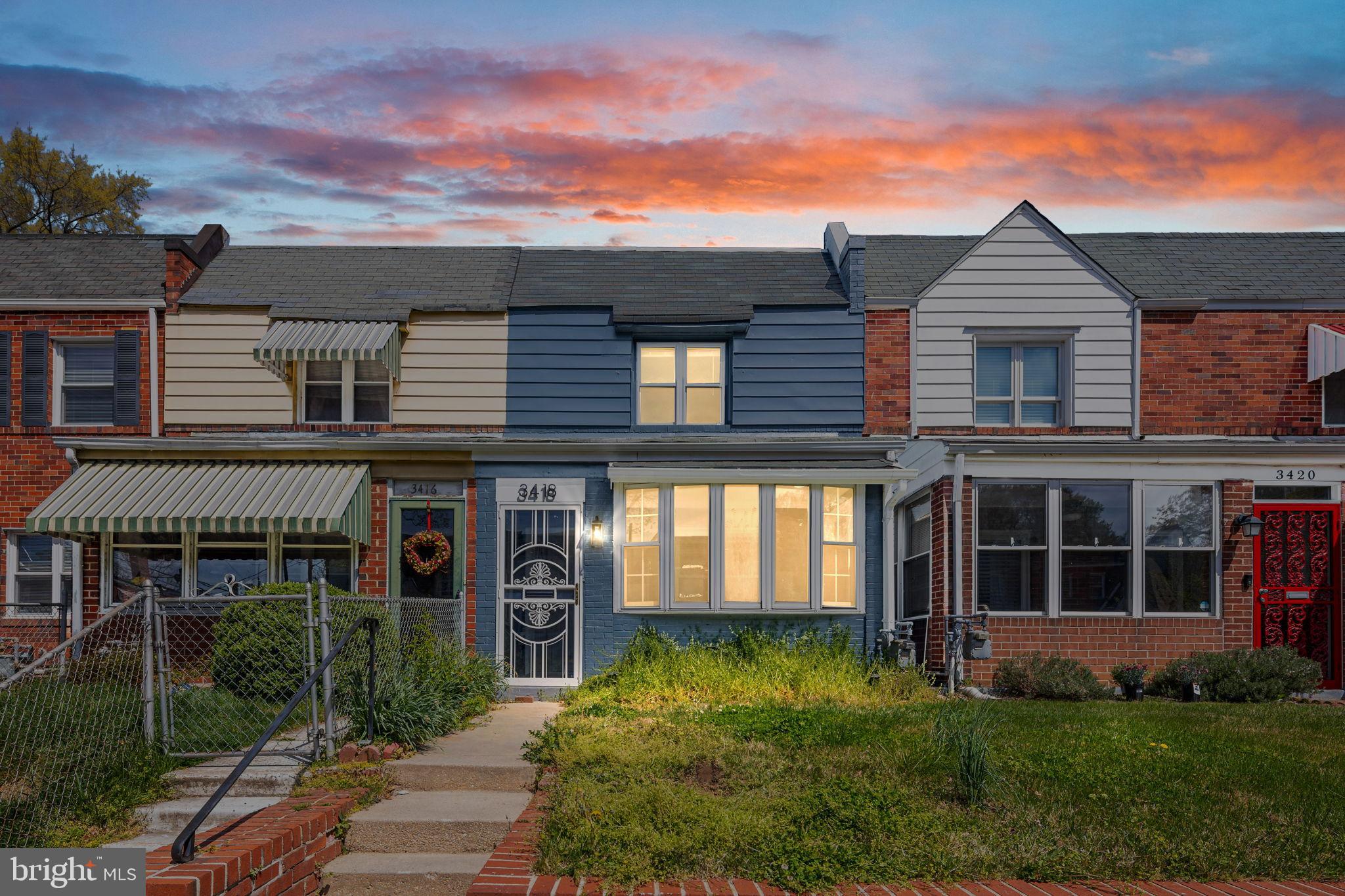 front view of a house with a yard