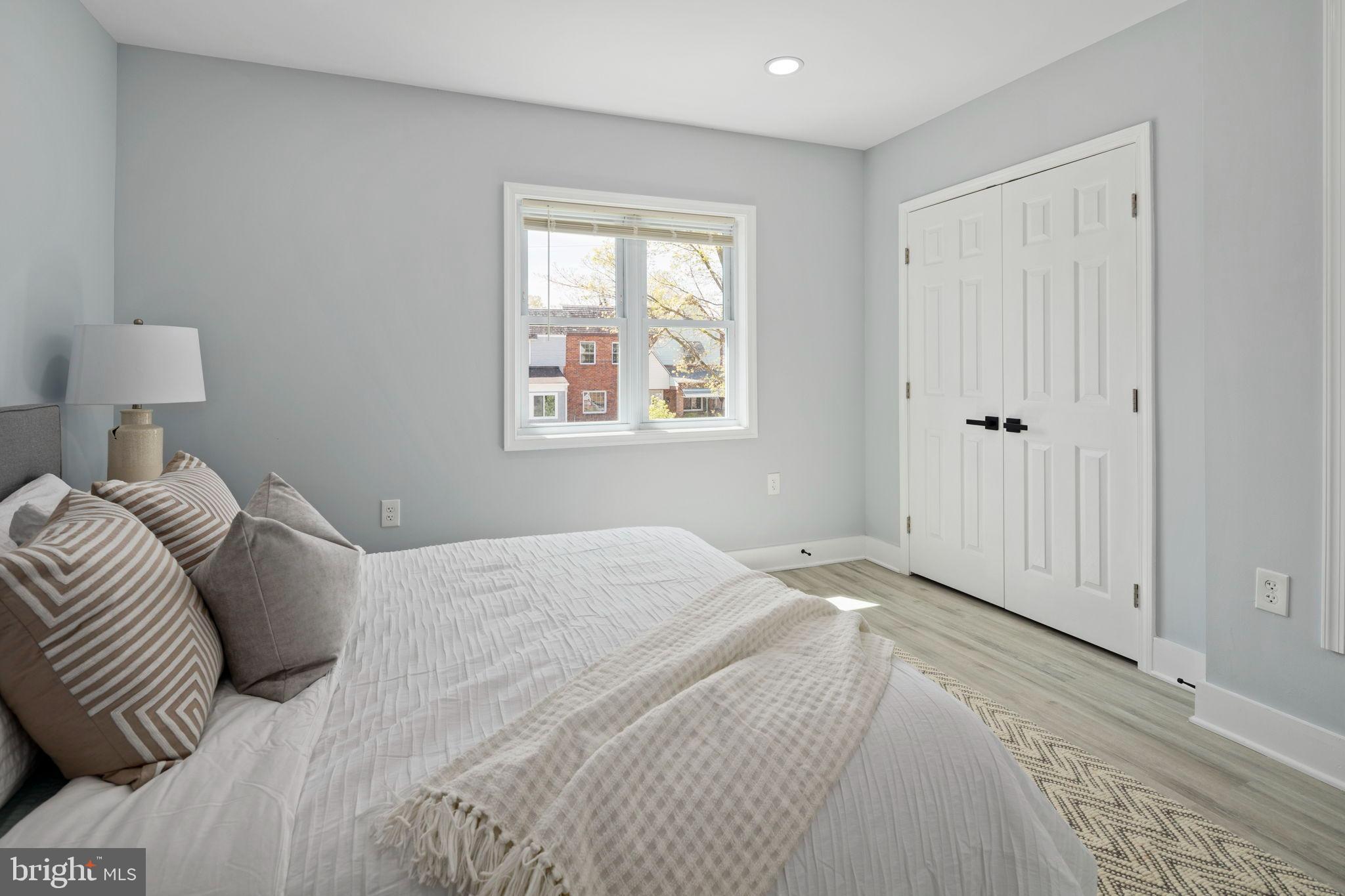 3418 Baker Street Northeast Washington, DC 20019 - Photo 16 of 46 a bedroom with a bed and a window