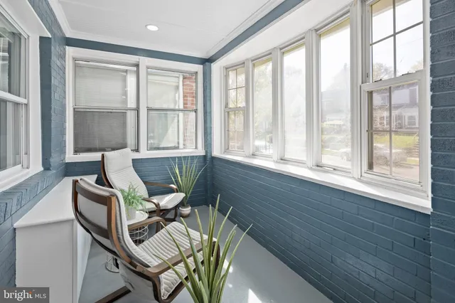 a view of a work space with wooden floor and furniture