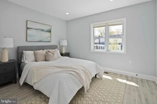 a bedroom with bed and a window