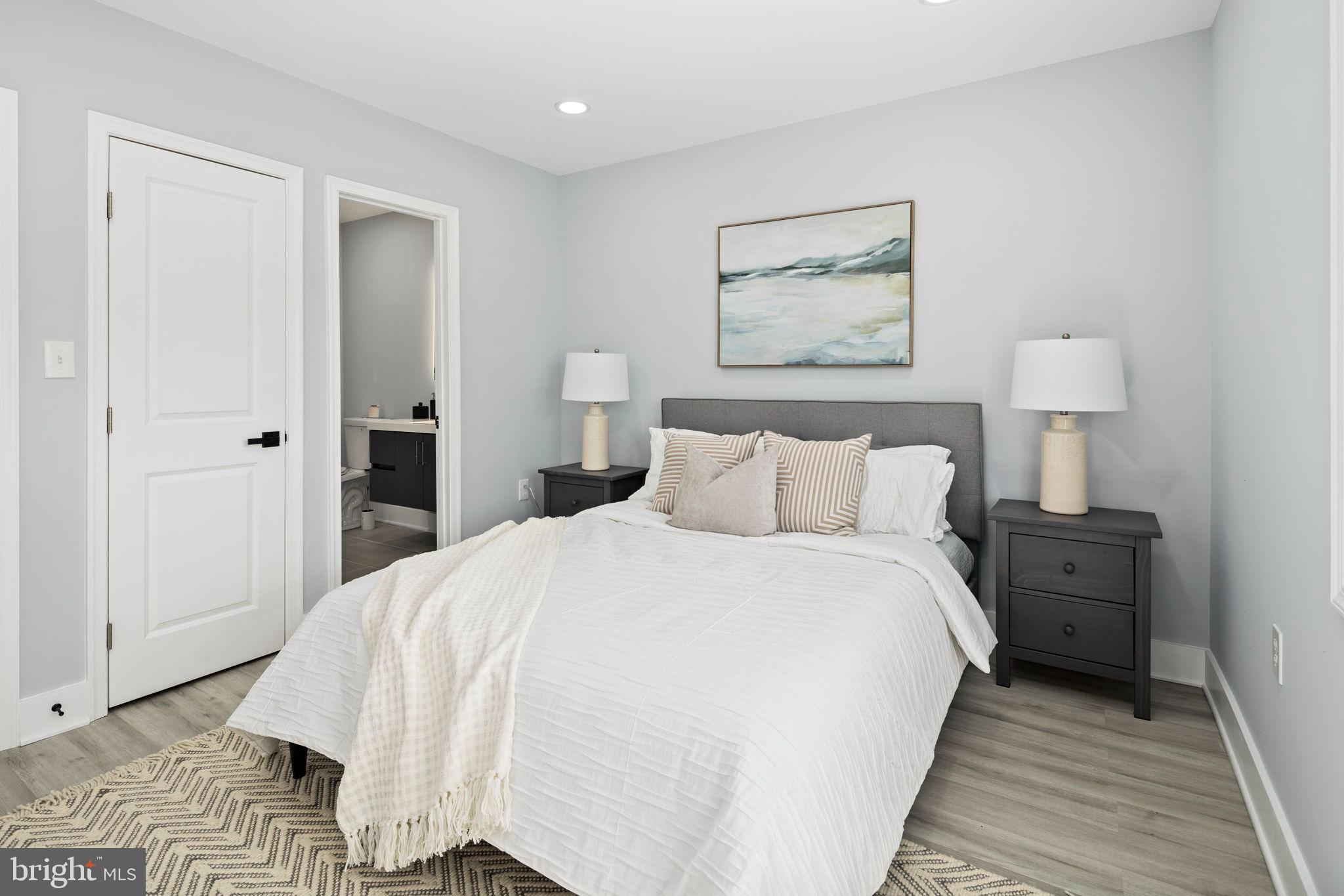 3418 Baker Street Northeast Washington, DC 20019 - Photo 35 of 46 a bed room with a bed and a night stand