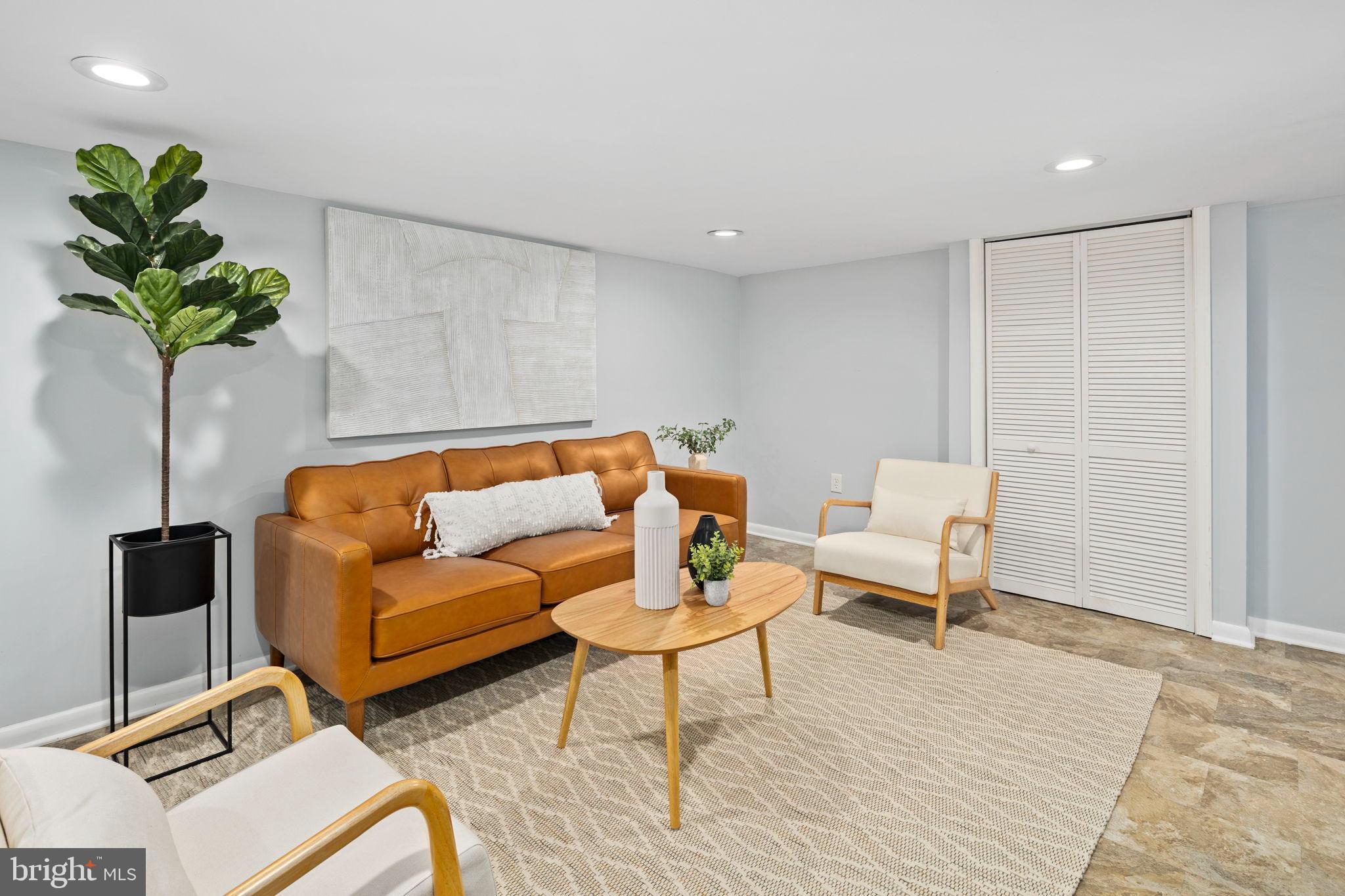 3418 Baker Street Northeast Washington, DC 20019 - Photo 41 of 46 a living room with furniture and a potted plant
