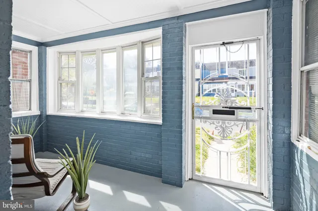 a view of a livingroom with furniture and a window