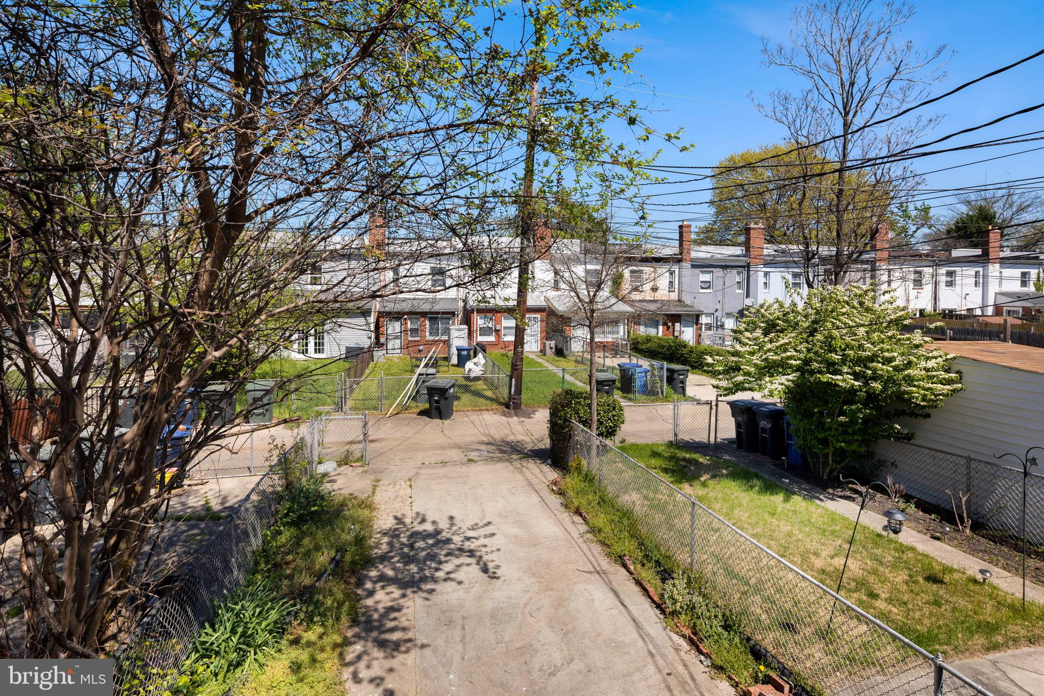 3418 Baker Street Northeast Washington, DC 20019 - Photo 44 of 46 a view of a yard with plants and large trees