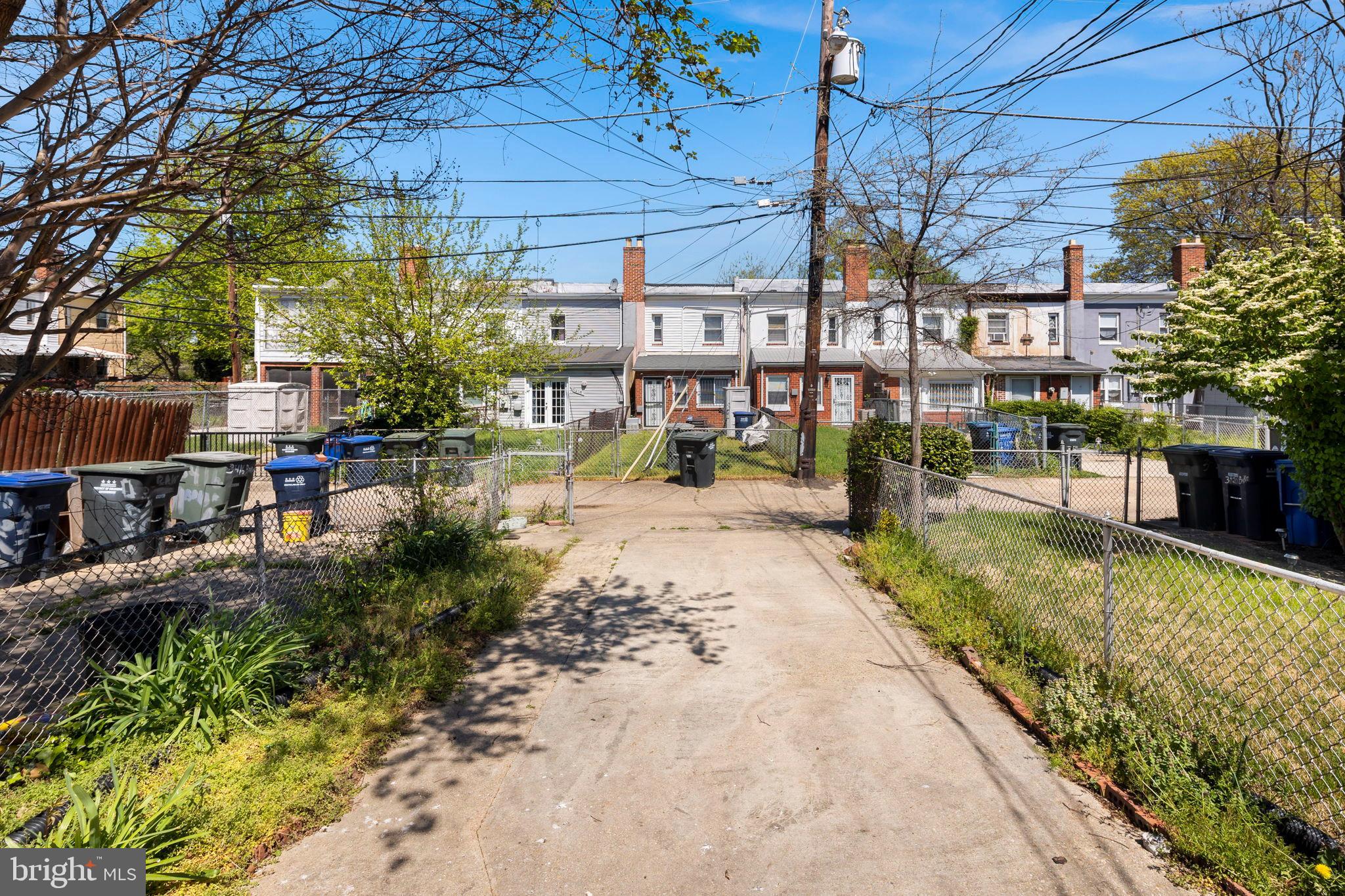 3418 Baker Street Northeast Washington, DC 20019 - Photo 45 of 46 a view of a yard with plants and a barbeque