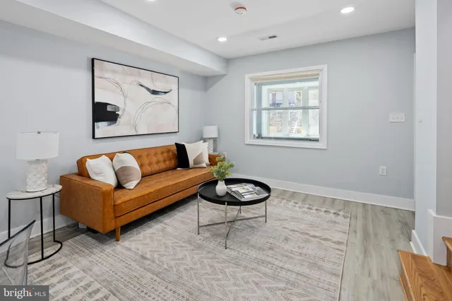 a living room with furniture and a window