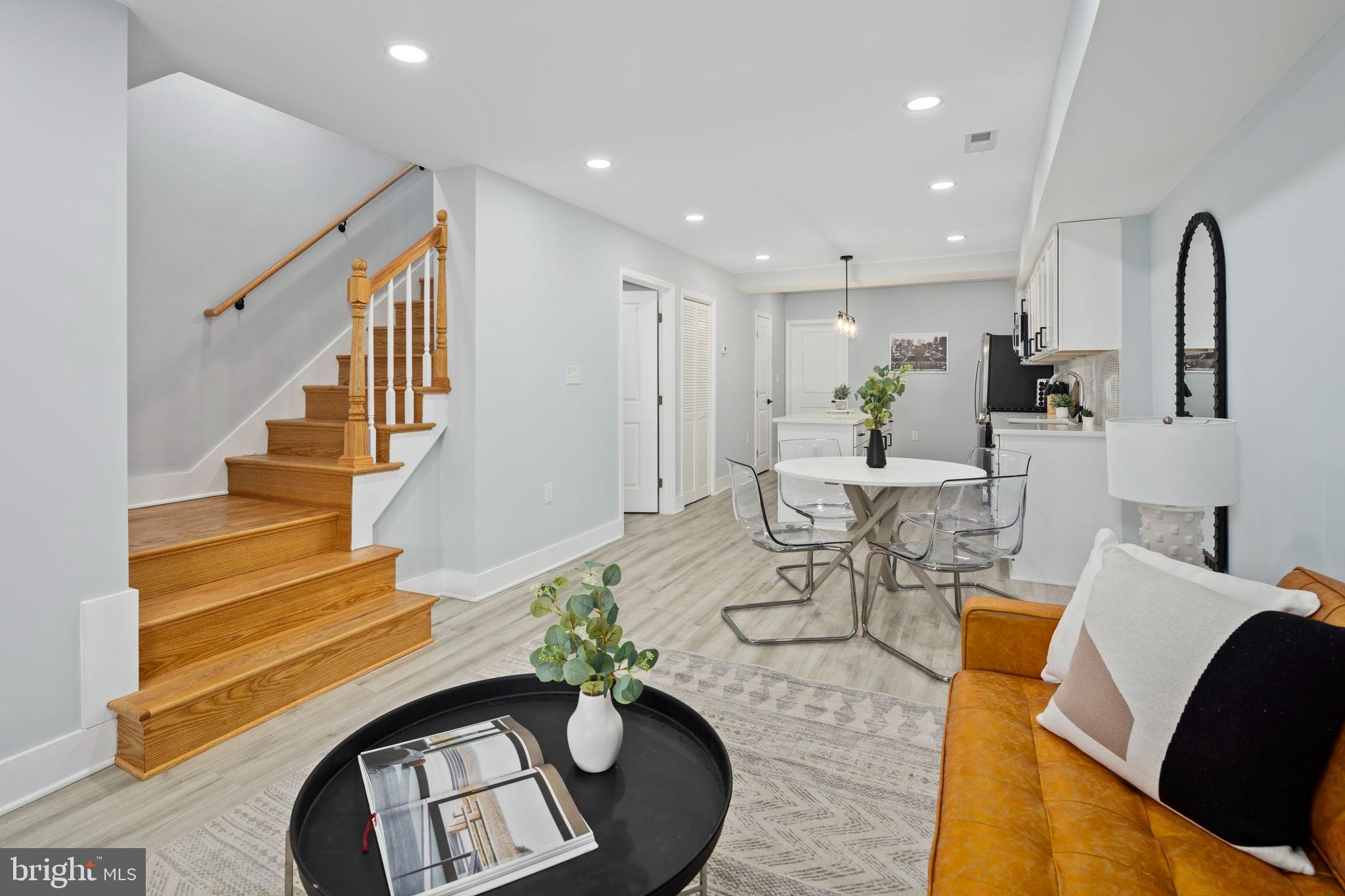 3418 Baker Street Northeast Washington, DC 20019 - Photo 10 of 46 a living room with furniture and a chandelier