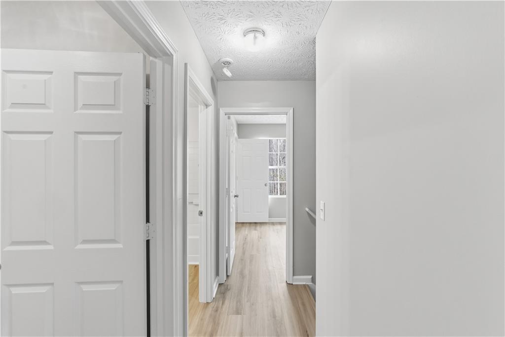3789 Waldrop Lane Decatur, GA 30034 - Photo 11 of 22 a view of a hallway with wooden floor
