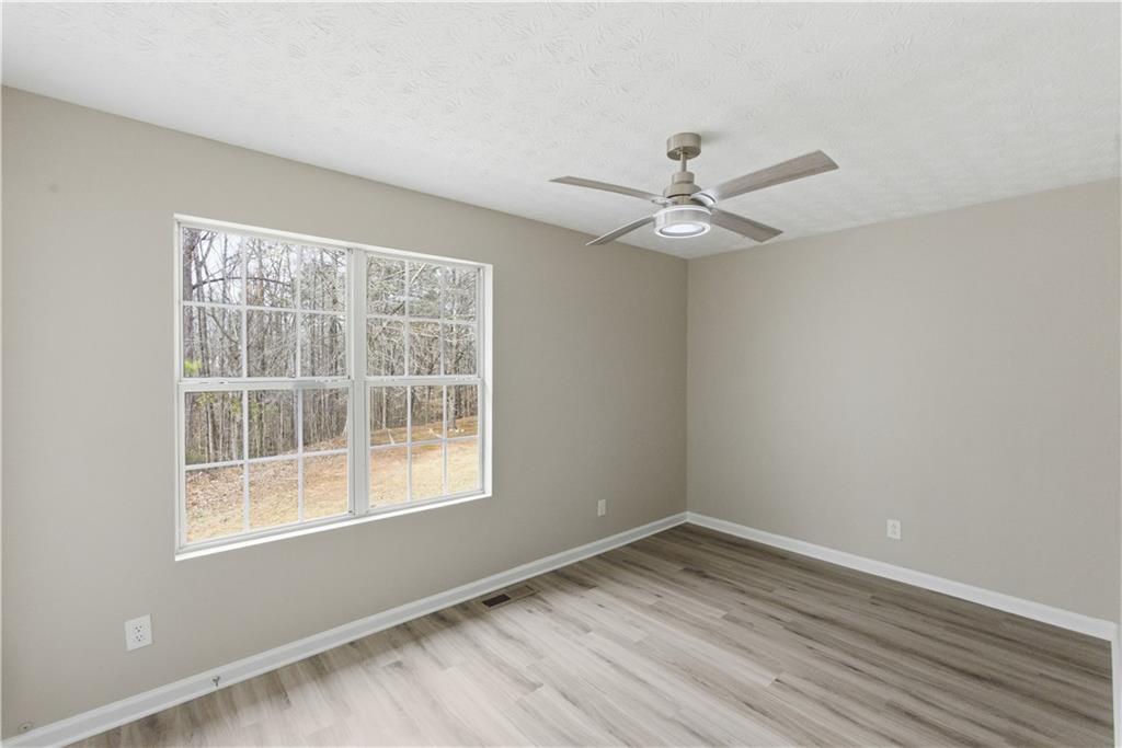 3789 Waldrop Lane Decatur, GA 30034 - Photo 13 of 22 wooden floor in an empty room with a window