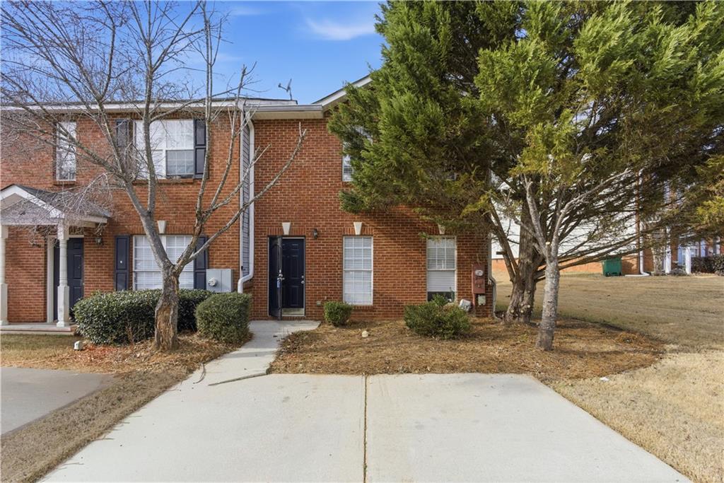 3789 Waldrop Lane Decatur, GA 30034 - Photo 2 of 22 a front view of a house with a yard and garage