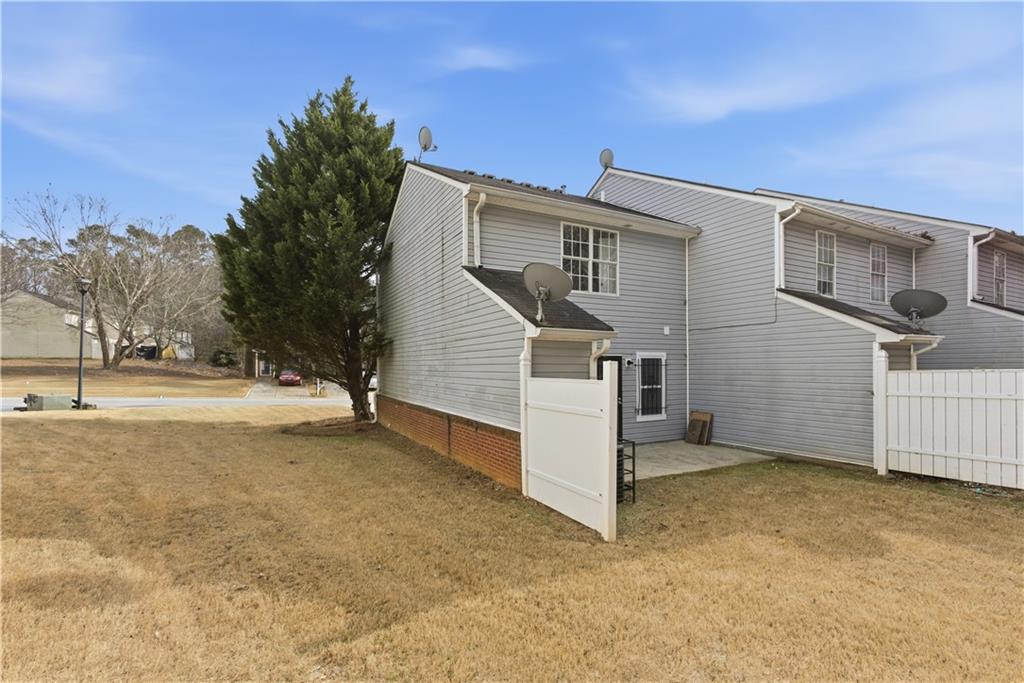 3789 Waldrop Lane Decatur, GA 30034 - Photo 22 of 22 a view of backyard with barbeque grill and wooden fence