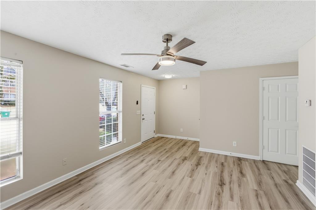 3789 Waldrop Lane Decatur, GA 30034 - Photo 5 of 22 wooden floor in an empty room with a window
