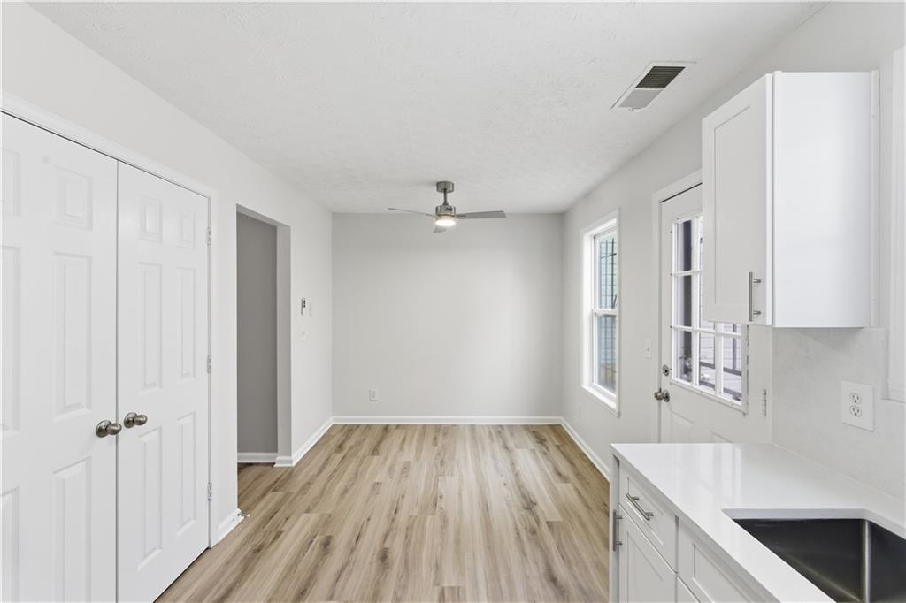 3789 Waldrop Lane Decatur, GA 30034 - Photo 7 of 22 a view of a kitchen with wooden floor