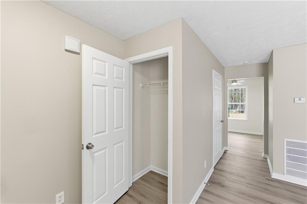 3789 Waldrop Lane Decatur, GA 30034 - Photo 9 of 22 a view of a hallway with wooden floor