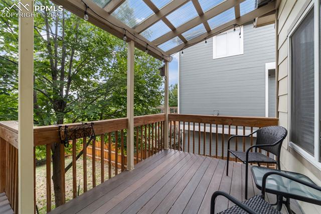 7730 Julynn Road Colorado Springs, CO 80919 - Photo 30 of 48 Wooden deck with a pergola