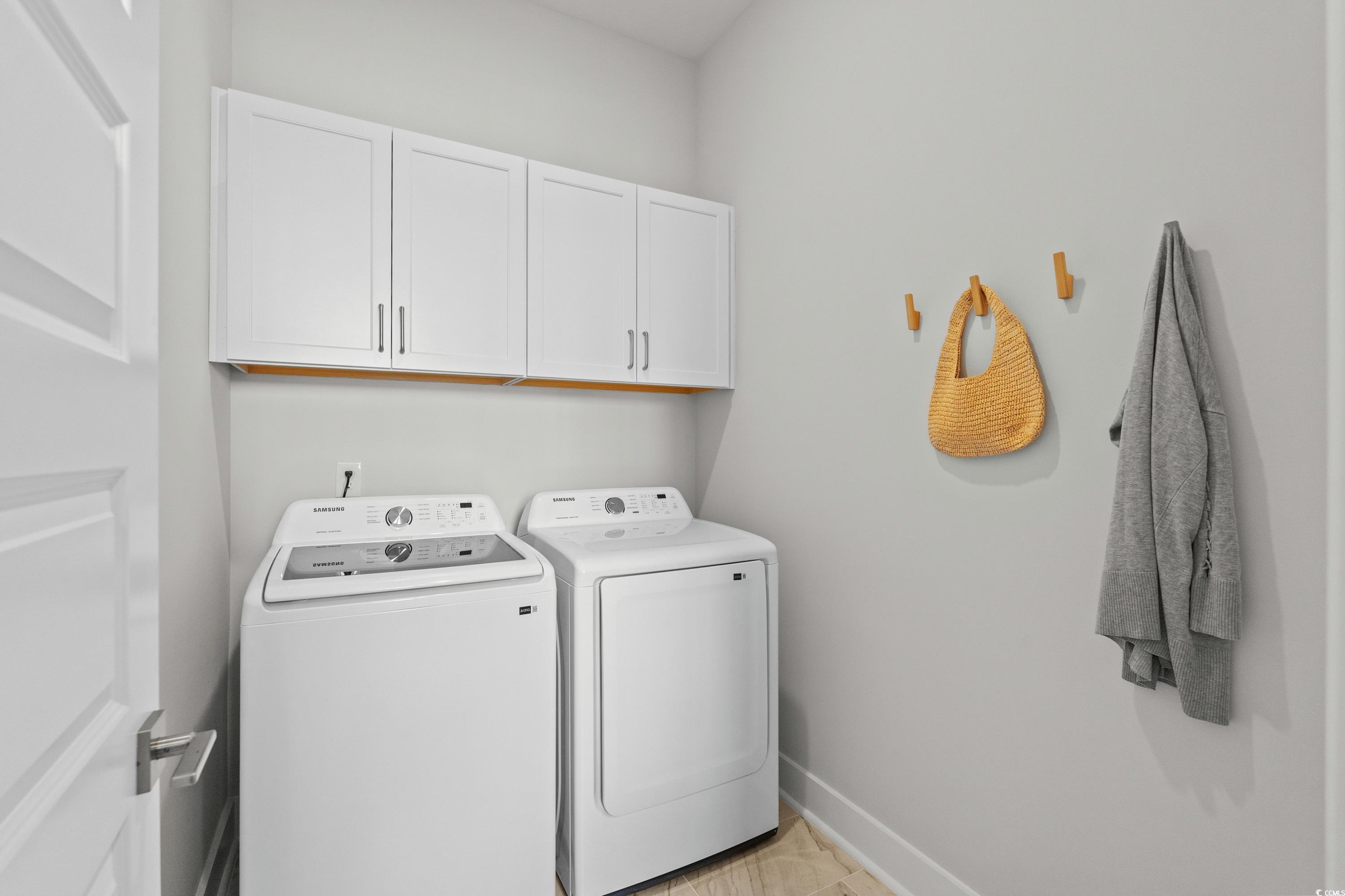 906 Foxtail Drive, Unit D44 Longs, SC 29568 - Photo 10 of 34 Kitchen with white cabinets, appliances with stainless steel finishes, recessed lighting, light wood-style flooring, and hanging light fixtures