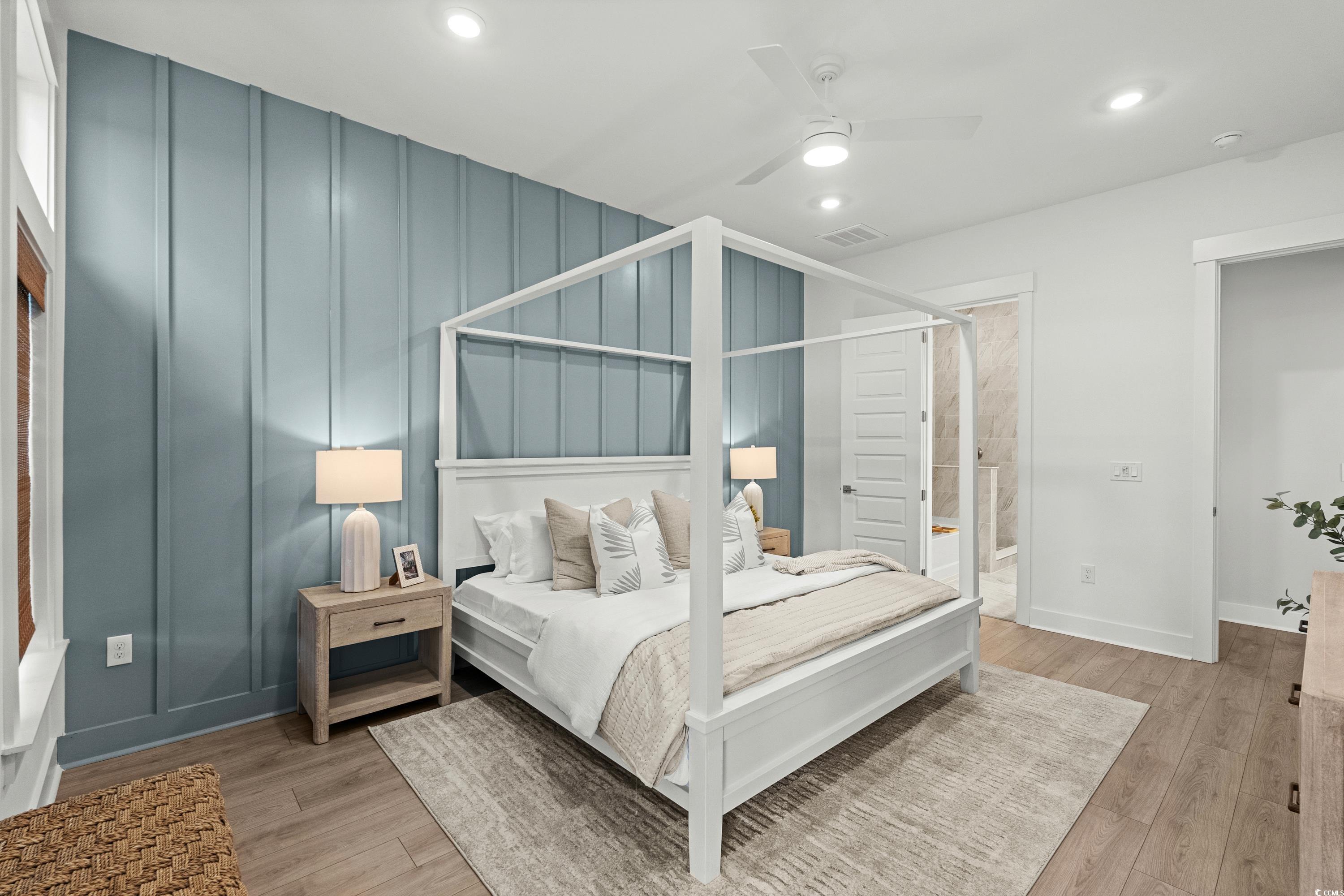 906 Foxtail Drive, Unit D44 Longs, SC 29568 - Photo 14 of 34 Bedroom featuring multiple windows, access to outside, a decorative wall, light wood-style floors, and recessed lighting