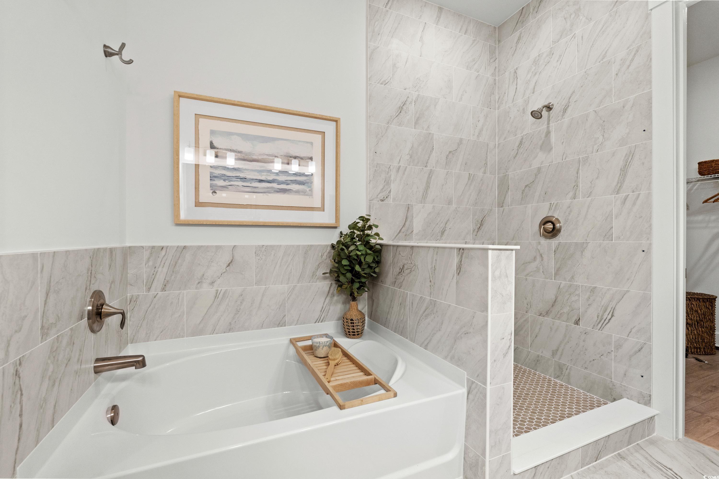 906 Foxtail Drive, Unit D44 Longs, SC 29568 - Photo 16 of 34 Full bath with tile walls, a bath, a tile shower, double vanity, and a walk in closet