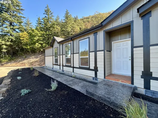 a front view of a house with a yard