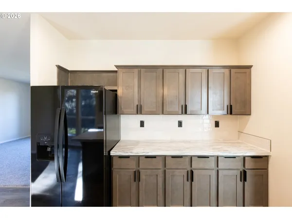 a bathroom with a sink vanity and a mirror
