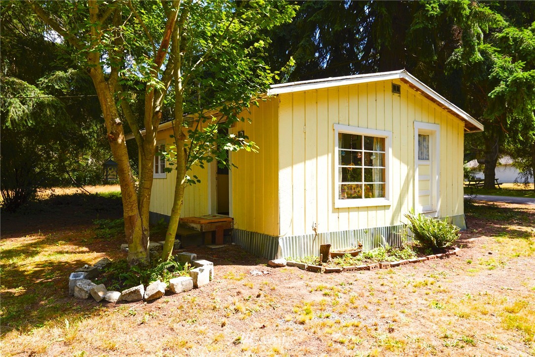 1505 East Roy Road Freeland, WA 98249 - Photo 1 of 13 a front view of a house with a yard