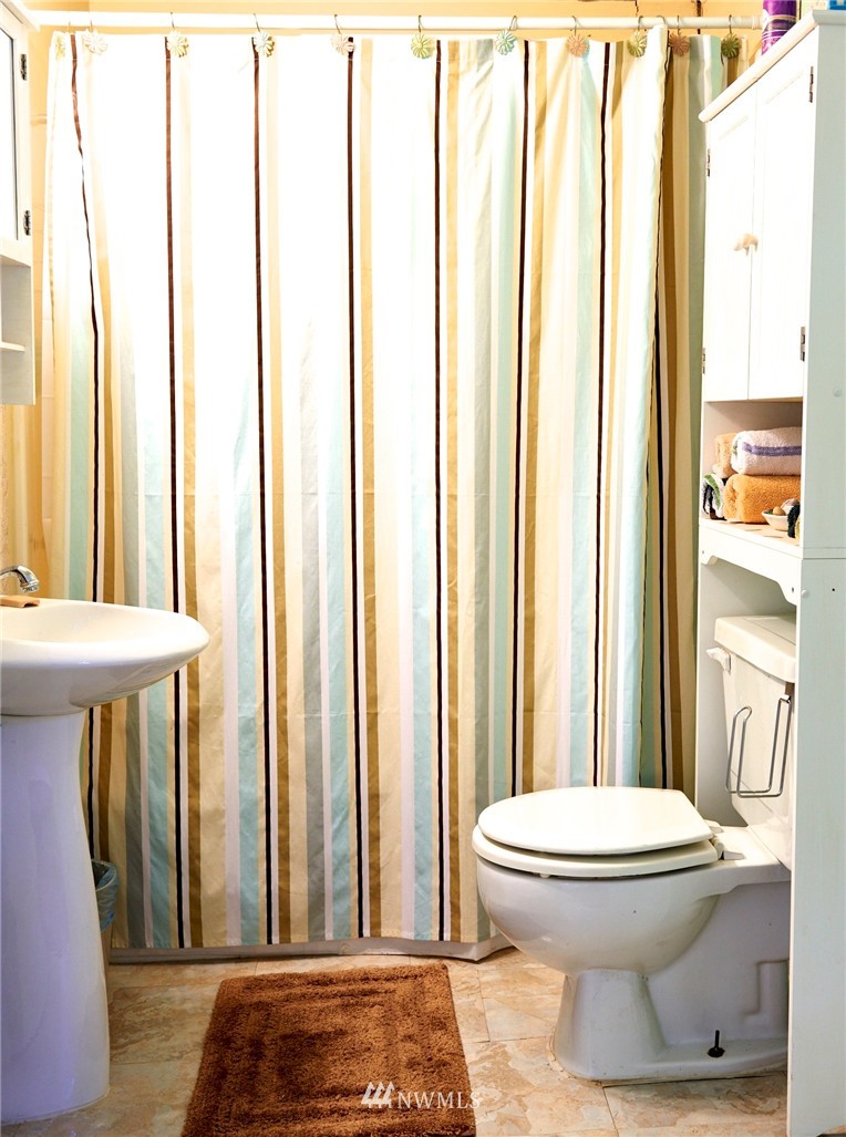 1505 East Roy Road Freeland, WA 98249 - Photo 6 of 13 a bathroom with a toilet and a shower