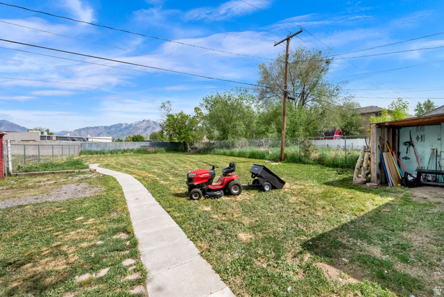 4635 Box Elder Street Murray, UT 84107 - Photo 21 of 21 Fenced yard with a mountain view