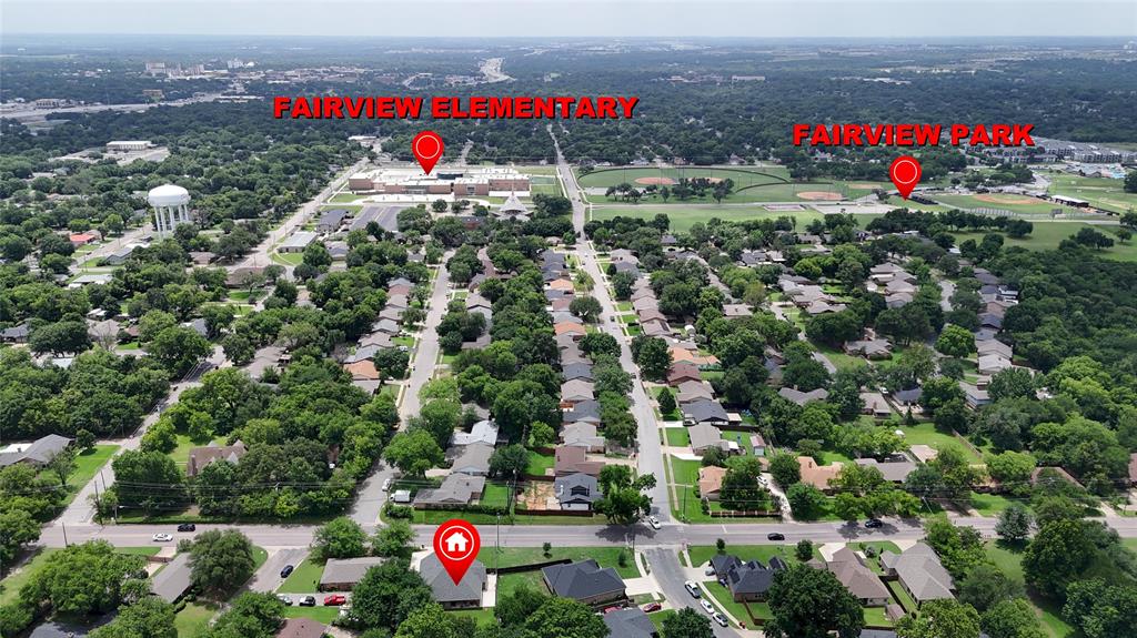 701 West Lamberth Road Sherman, TX 75092 - Photo 36 of 37 Aerial view of a residential neighborhood featuring numerous mature trees and a grid of streets