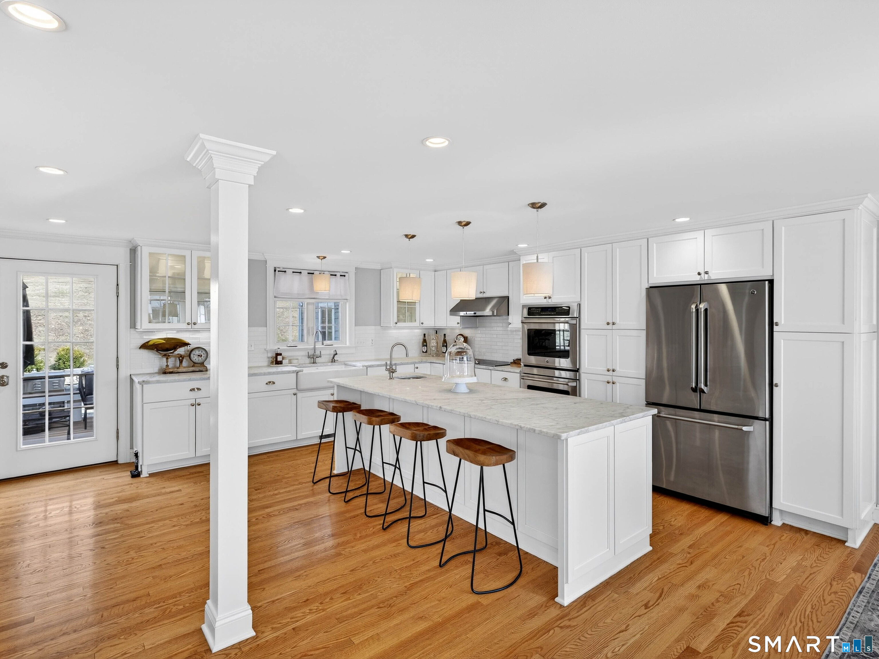 41 Old W Road East Haddam, CT 06423 - Photo 15 of 39 a kitchen with stainless steel appliances granite countertop a refrigerator a stove a sink dishwasher and white countertops with wooden floor