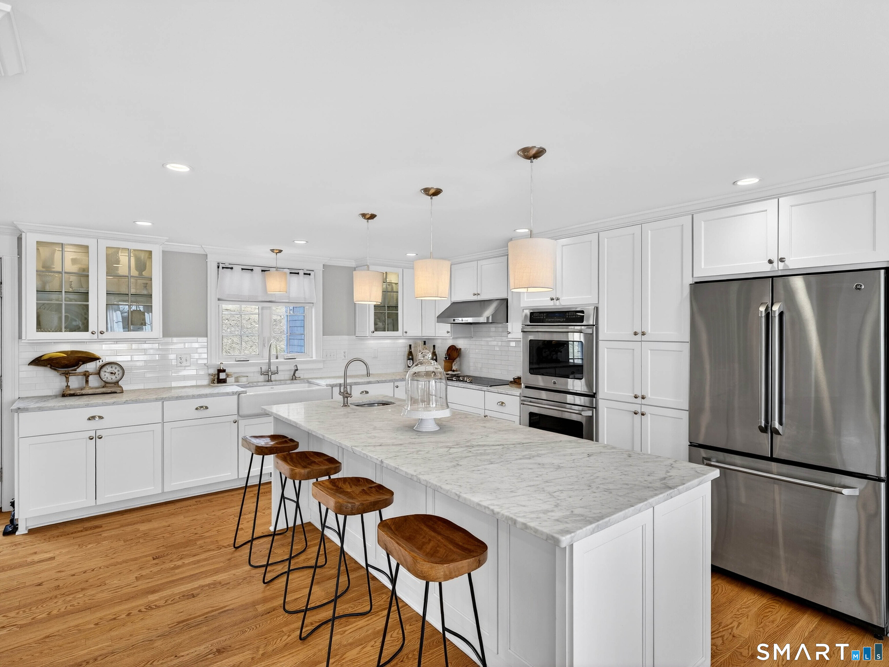 41 Old W Road East Haddam, CT 06423 - Photo 16 of 39 a kitchen with stainless steel appliances a refrigerator a stove a sink a dining table and chairs