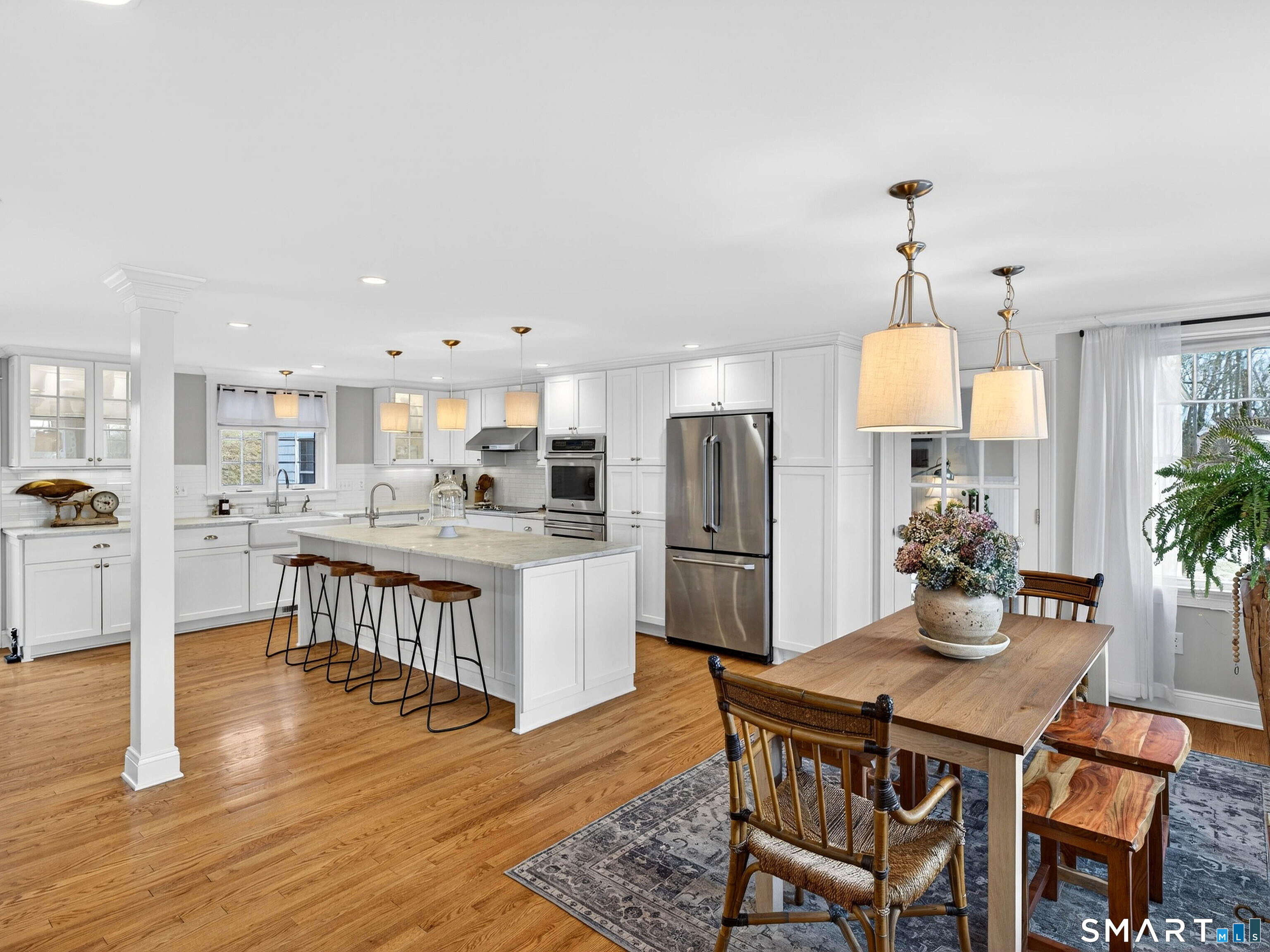 41 Old W Road East Haddam, CT 06423 - Photo 22 of 39 a kitchen with stainless steel appliances a dining table chairs and wooden floor