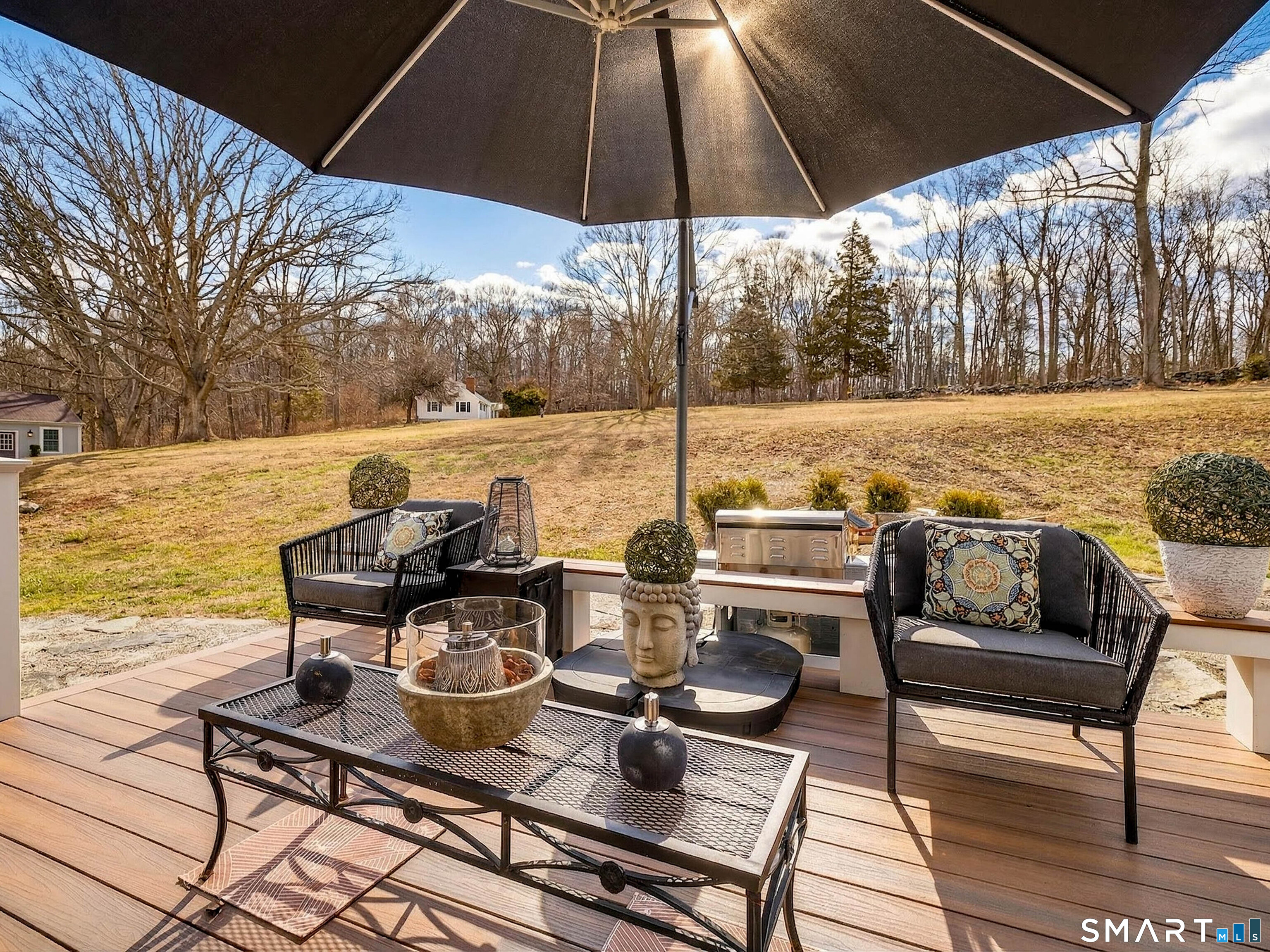 41 Old W Road East Haddam, CT 06423 - Photo 29 of 39 a view of a lake with couches and table under an umbrella