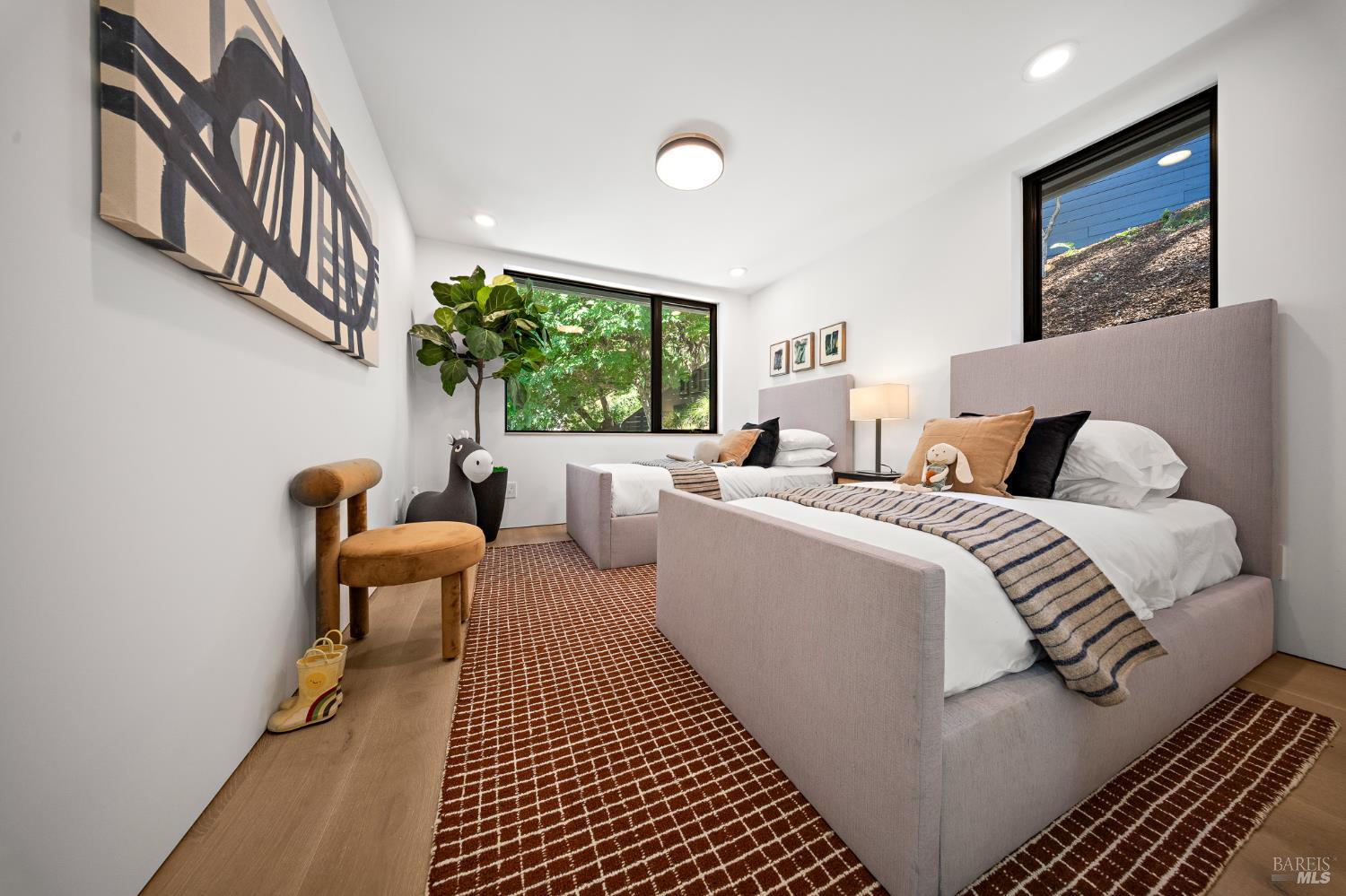 975 Greenhill Road Mill Valley, CA 94941 - Photo 11 of 53 a bedroom with a bed and a large window