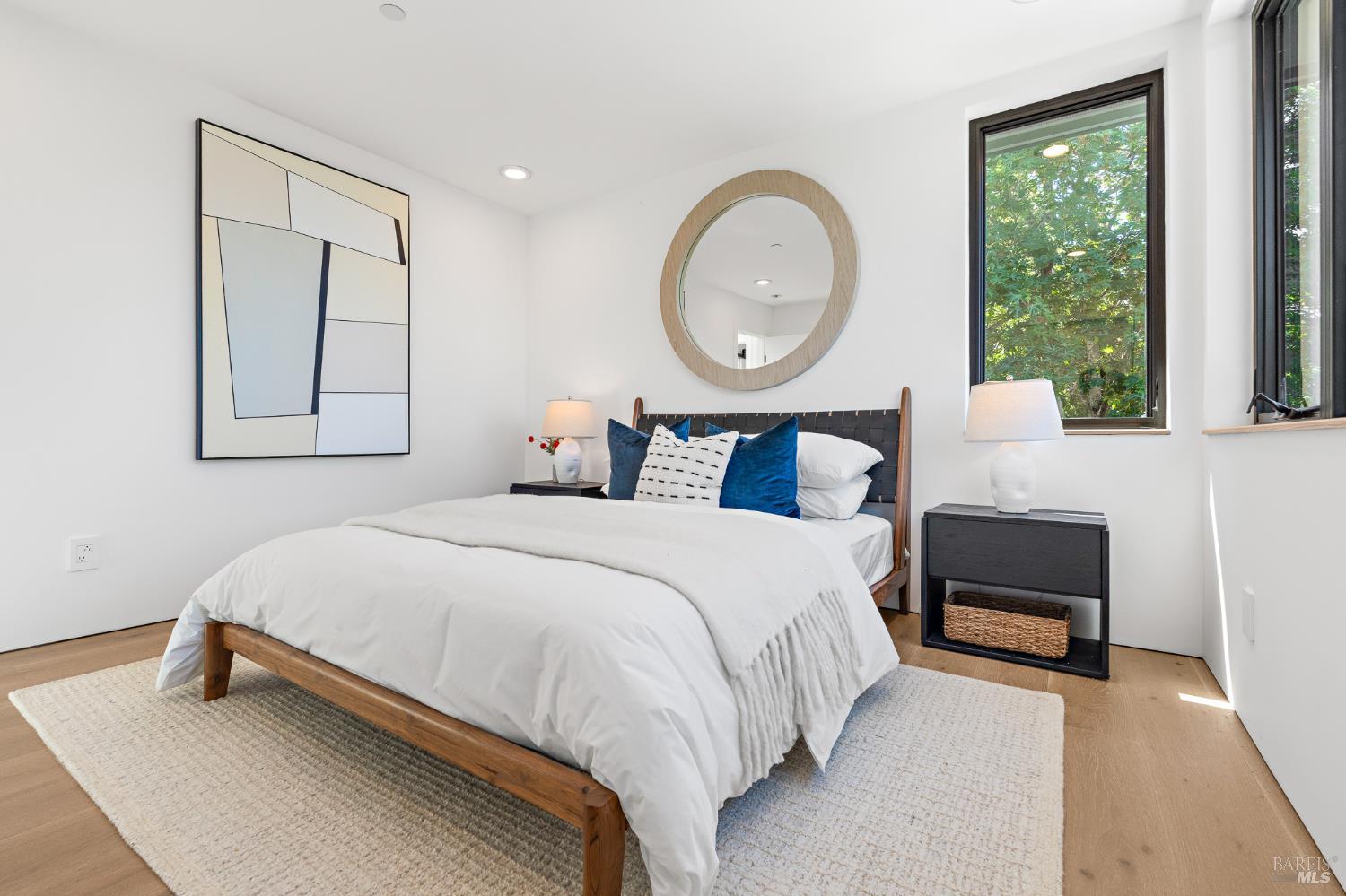 975 Greenhill Road Mill Valley, CA 94941 - Photo 33 of 53 a bedroom with a bed a mirror and a large window