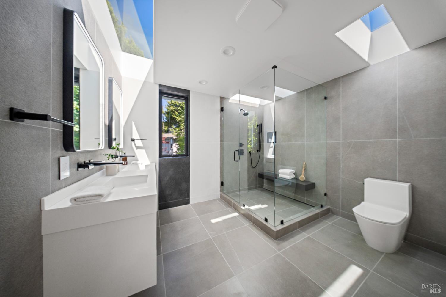 975 Greenhill Road Mill Valley, CA 94941 - Photo 8 of 53 a bathroom with a toilet sink and mirror