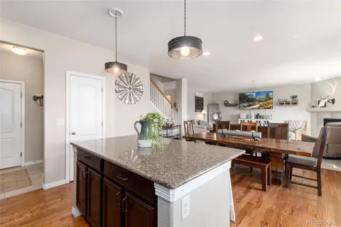 a kitchen with a dining table and chairs