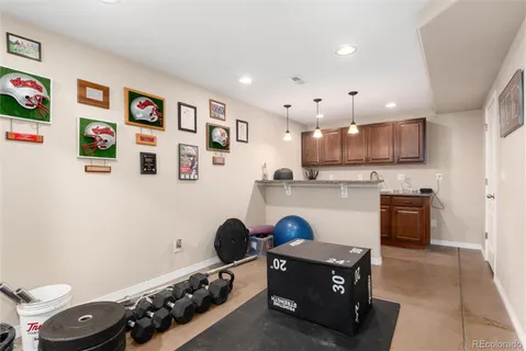 a kitchen with stainless steel appliances granite countertop a stove and a refrigerator