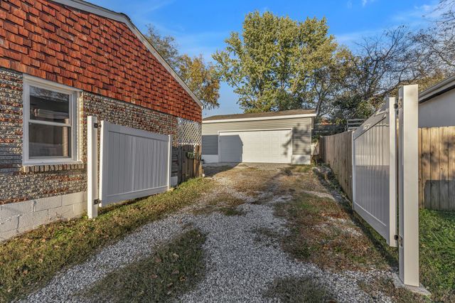 a view of a house with a back yard