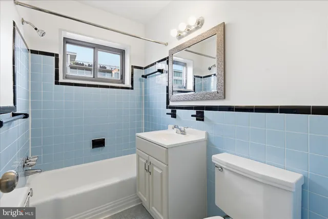 a bathroom with a toilet sink and bathtub
