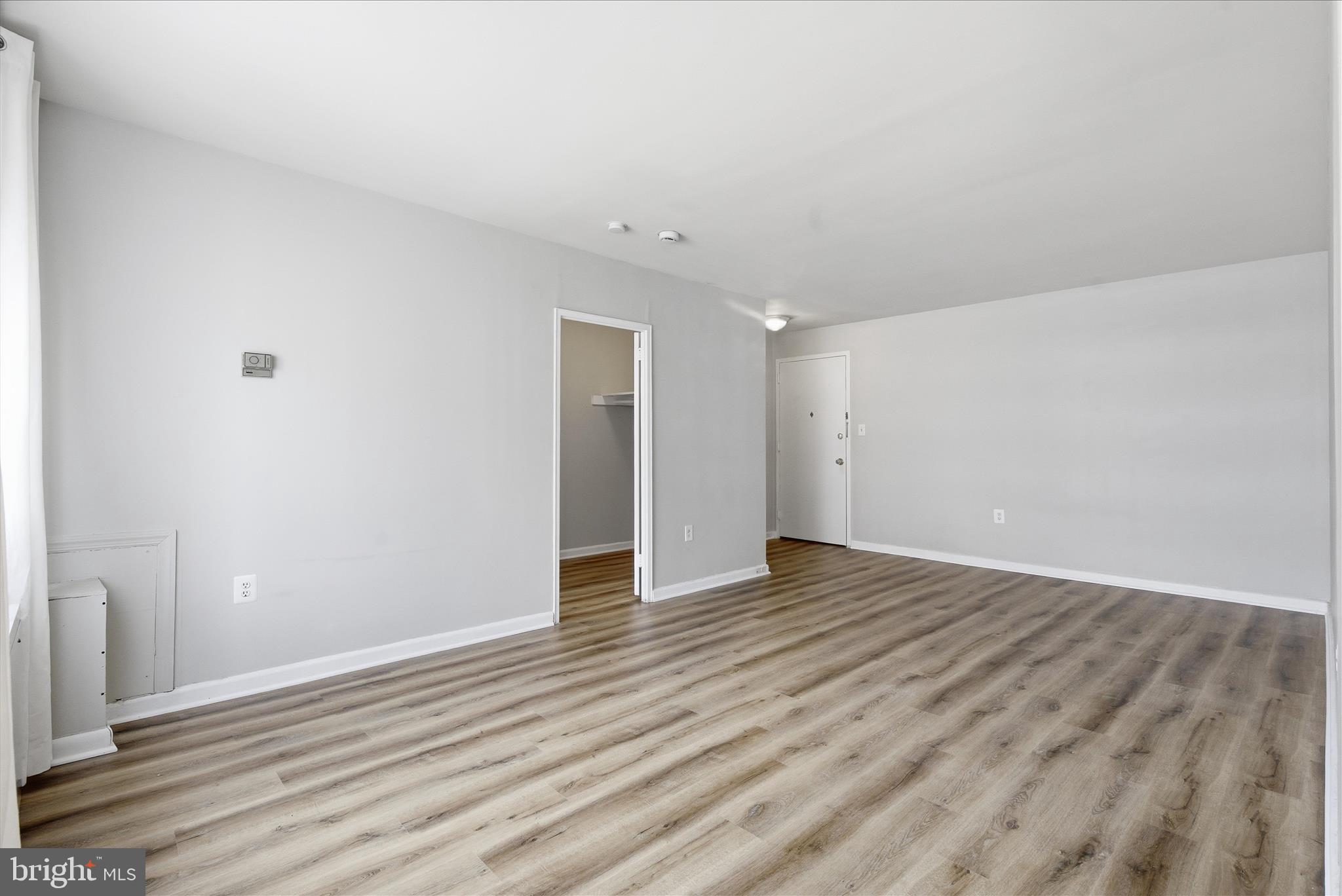 1200 South Arlington Ridge Road, Unit 717 Arlington, VA 22202 - Photo 6 of 24 a view of an empty room with wooden floor