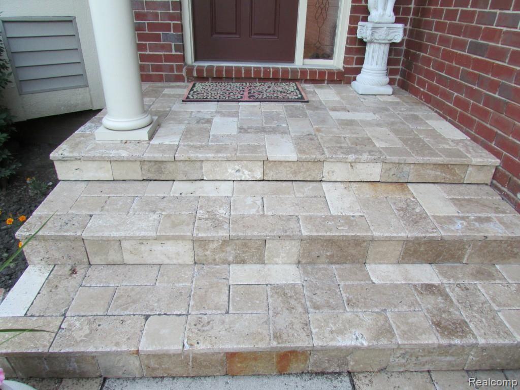 3052 St Clair Drive Rochester, MI 48309 - Photo 31 of 34 Stonework Steps and Covered Porch Leading to Front Door